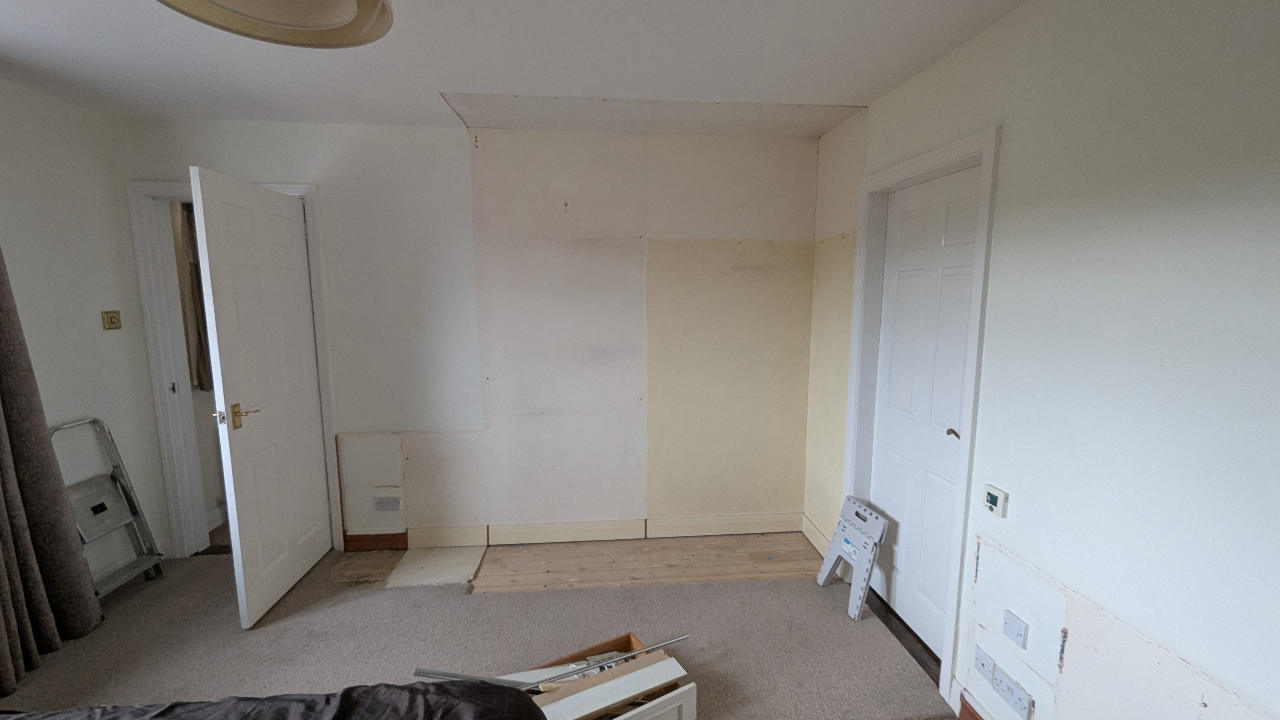 Bedroom left with walls sound and ready after fitted wardrobe removal
